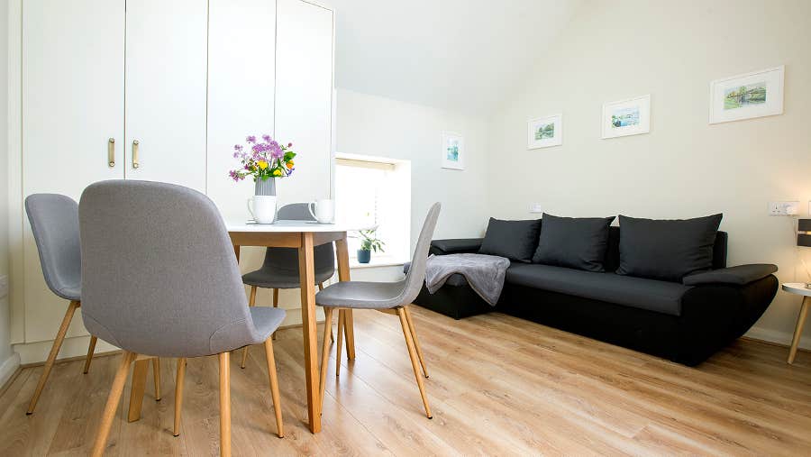 Sitting room with table and chairs and couch