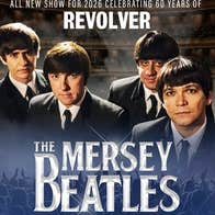 4 men in dark suits and ties looking slightly upwards as camera