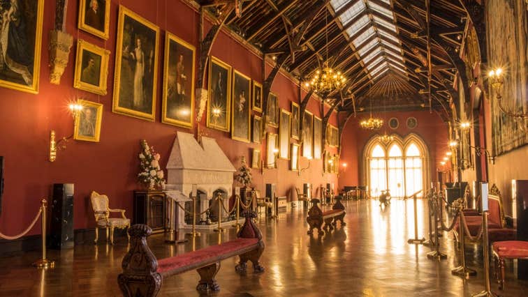 Portraits, arched windows and antique furnishings inside Kilkenny Castle, Co. Kilkenny in Ireland's Ancient East.