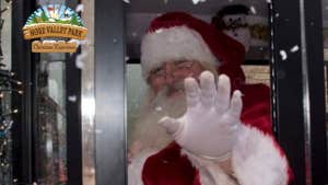 Nore Valley Park Santa Experience, Santa waving a hand.