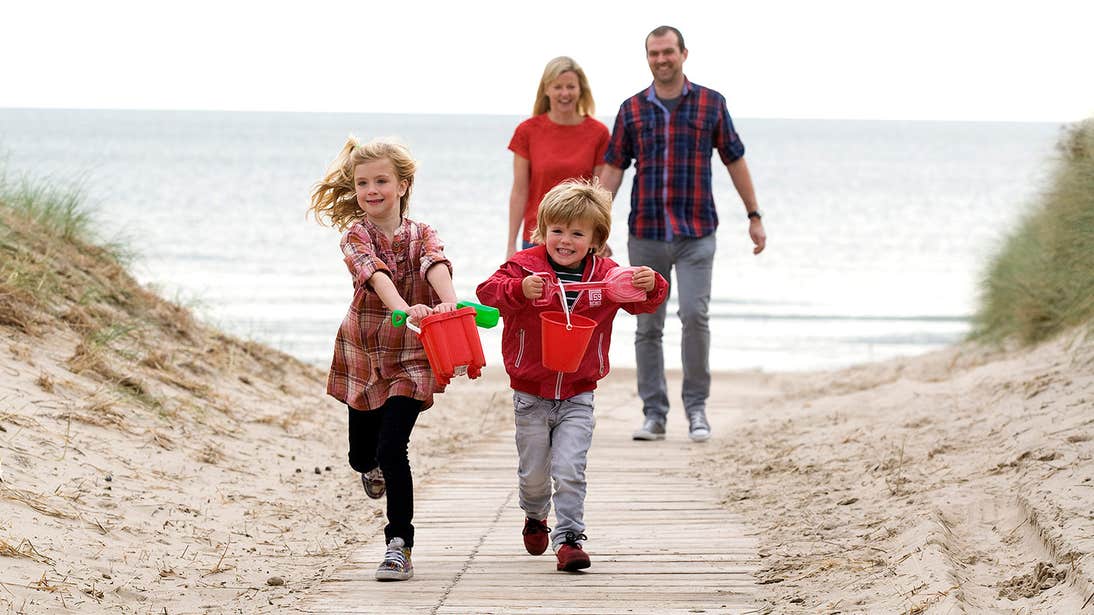 Children and adults having fun at the beach in Curracloe Beach, Wexford