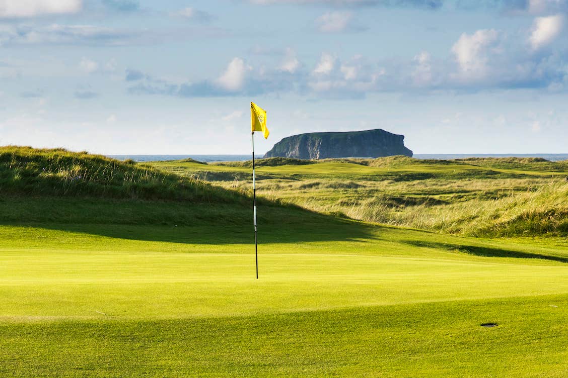 The hole and flag of a Ballyliffin Golf Course in Donegal.