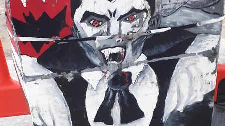 A vivid street art mural of Count Dracula, fangs bared and cape spread, painted on a utility box in Dublin — a colourful nod to the city's gothic legacy and Bram Stoker's most famous creation.