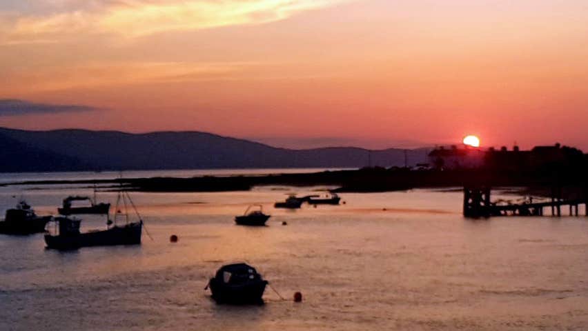 Boats on the water at sunset on Carlingford Lough