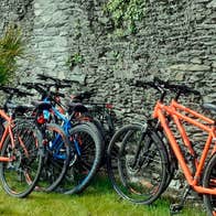 spike island ireland tours Bikes left up against a stone wall