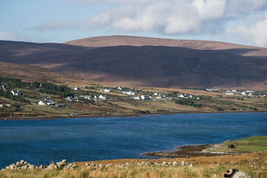 Houses near water on Inishbofin Island in County Galway
