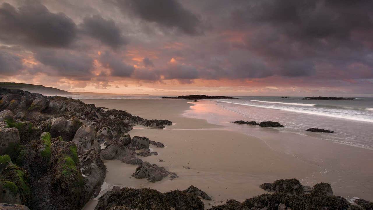 Views of Owenahincha Little Island Strand at sunset