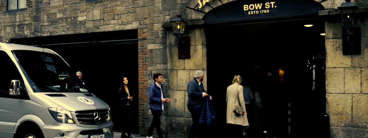 A group of people enter the Jameson Distillery in Bow Street