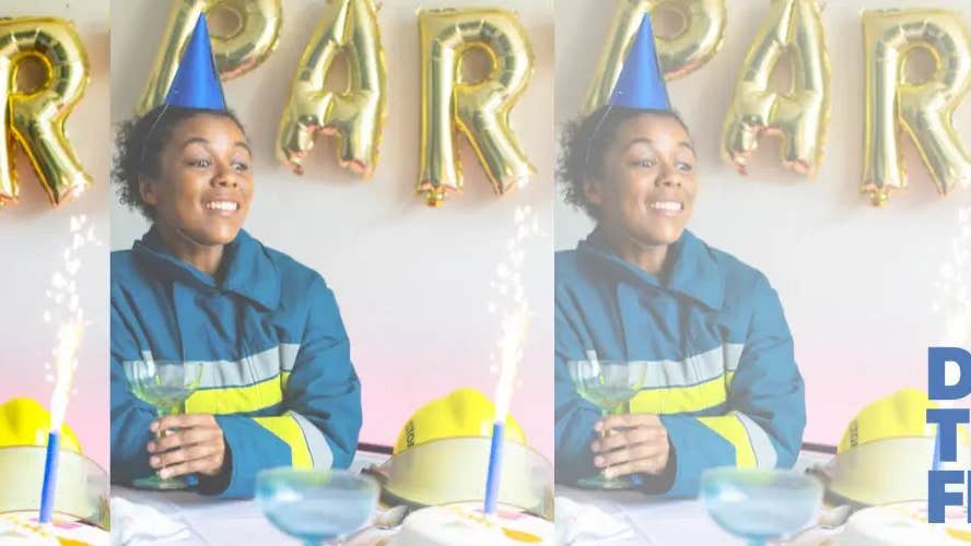 Lola, a firefighter, sits surrounded by birthday decorations
