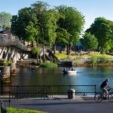 A man cycling on the banks of a river in Carrick-on-Shannon in County Leitrim