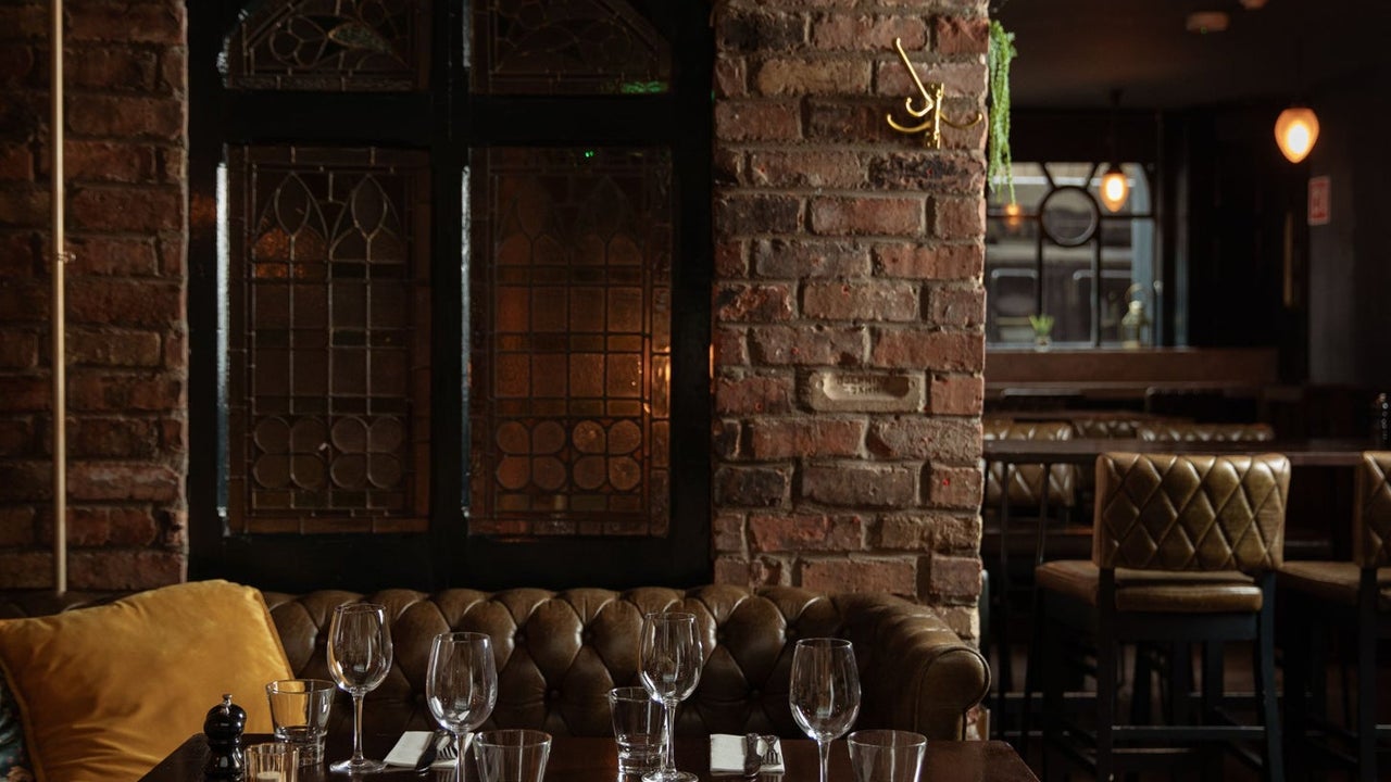 Dark wood tables prepared for dining