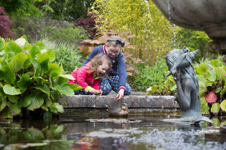 Two kids playing at the pond at Belvedere House and Gardens in Mullingar, County Westmeath