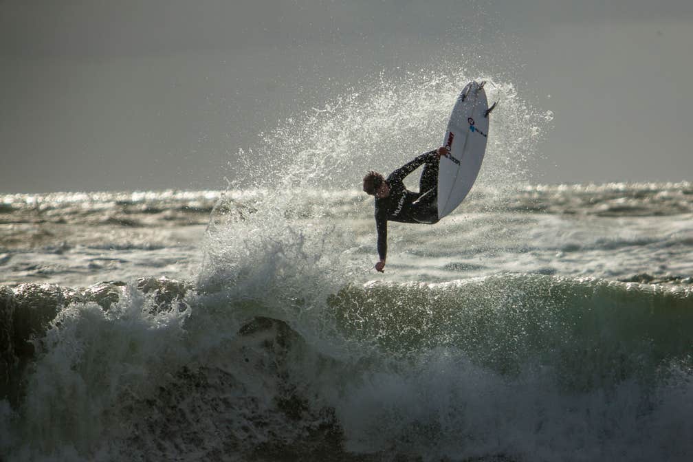 A surfer at Sea Sessions on Bundoran Beach in County Donegal
