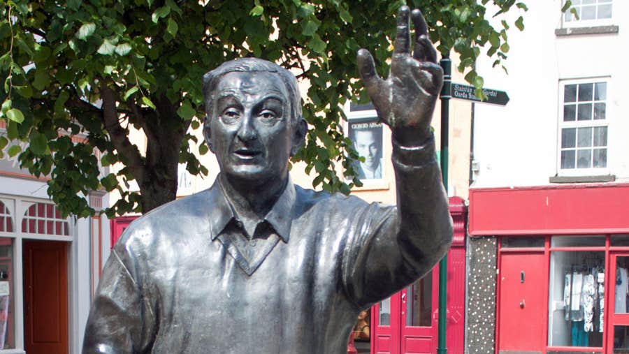 A bronze life sized statue of Listowel writer John B Keane