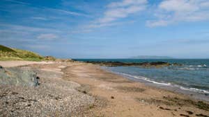 Views of the long sandy beach and sea at Donabate Balcarrick Beach
