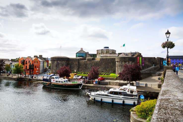 Boats cruising past Athlone Castle in Westmeath