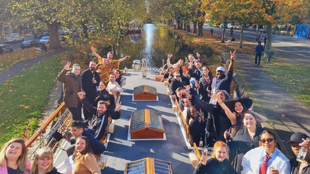 Group of passengers on the deck of a canal boat