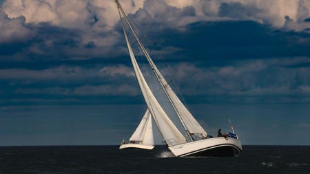 Two yachts on a dark day on Dublin Bay