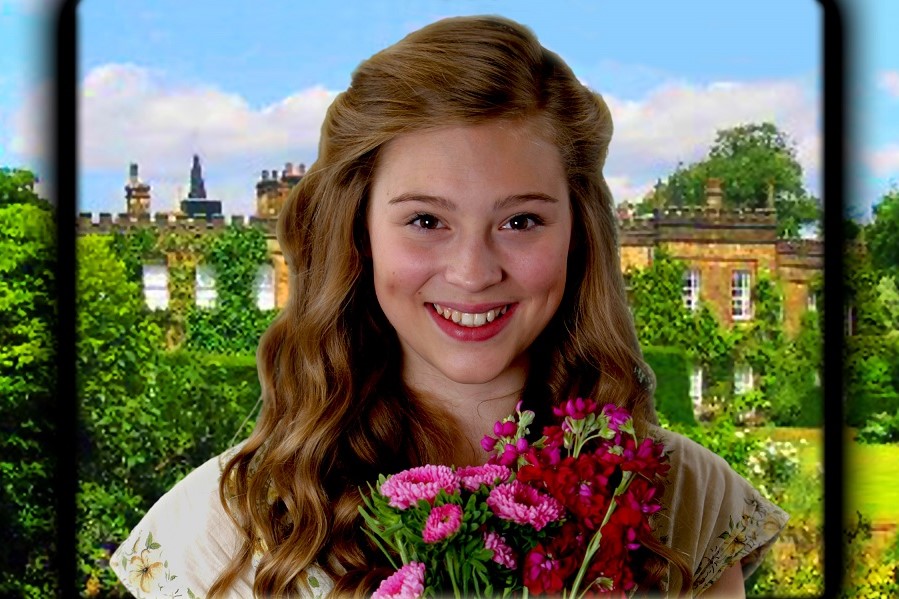 Chapterhouse Theatre Company Presents The Secret Garden as part of their UK and Ireland open-air theatre tour. Photo of close up on young woman smiling holding bunch of pink flowers with an old house in the background