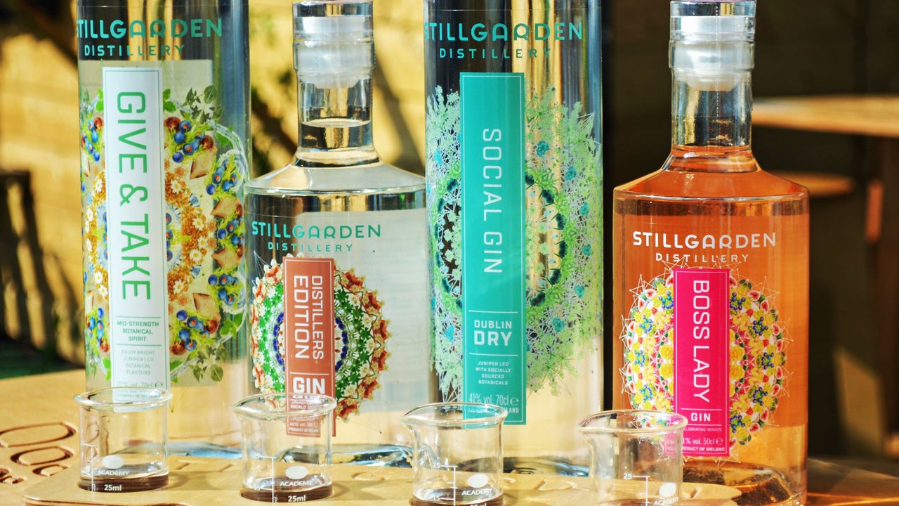 Stillgarden Distillery view of four bottles of craft gin and tasting samples