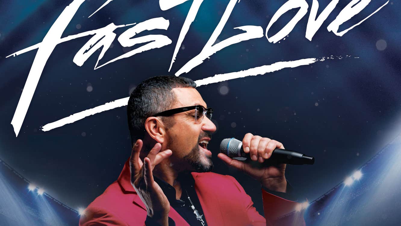 A man in sunglasses is singing into a mic