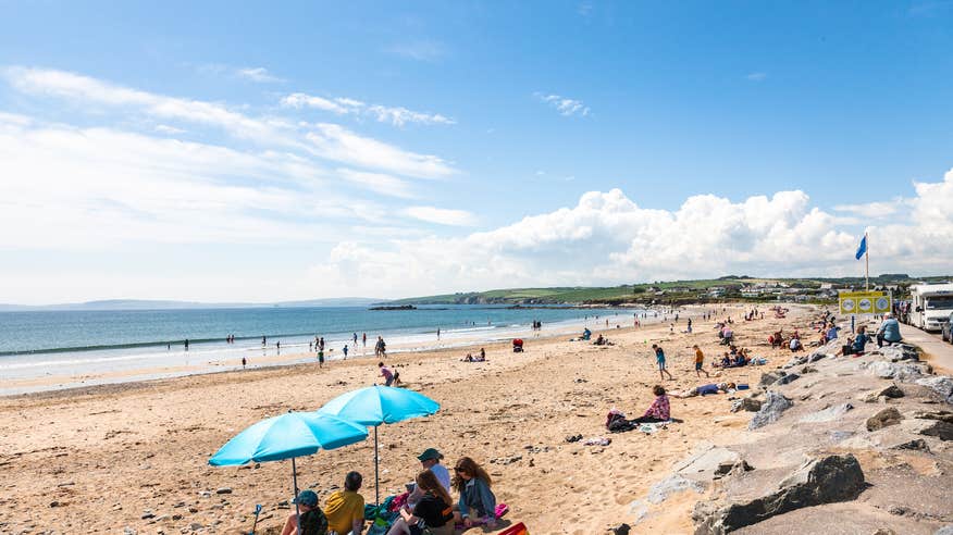 People on Garrylucas Beach in Cork on a sunny day