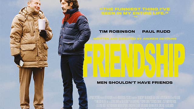 2 men in thick winter jackets talking to each other