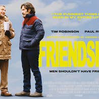 2 men in thick winter jackets talking to each other