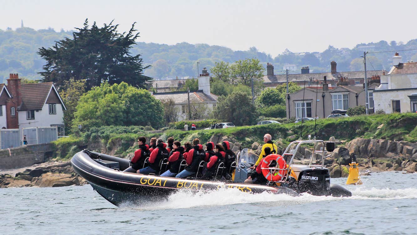 Goat Boat Tours view of a group speeding along the coast
