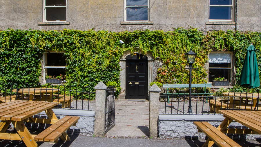 Entrance to accommodation with ivy frontage