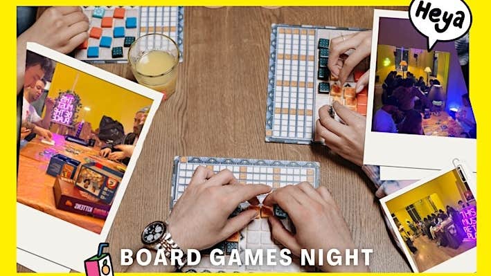 Looking down at hands on a table playing board games.