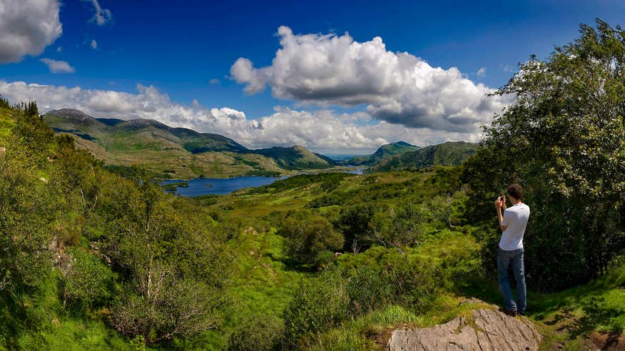 A man looking out at Ladies View in County Kerry.