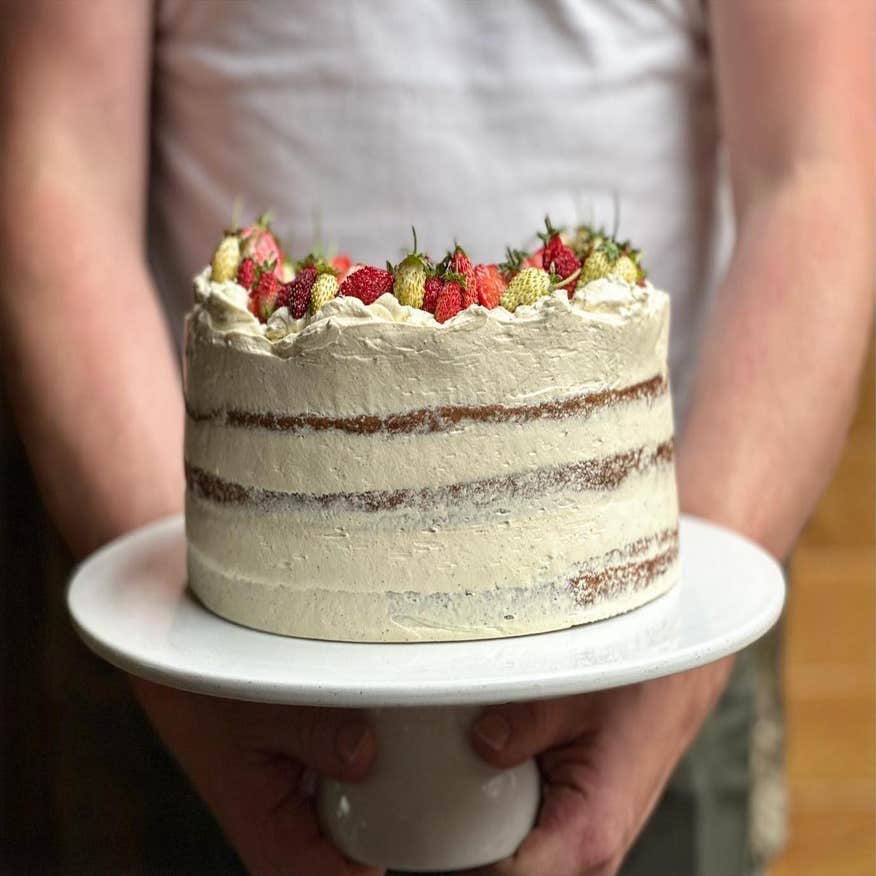 A person holding a cake from Kai restaurant in Galway city.