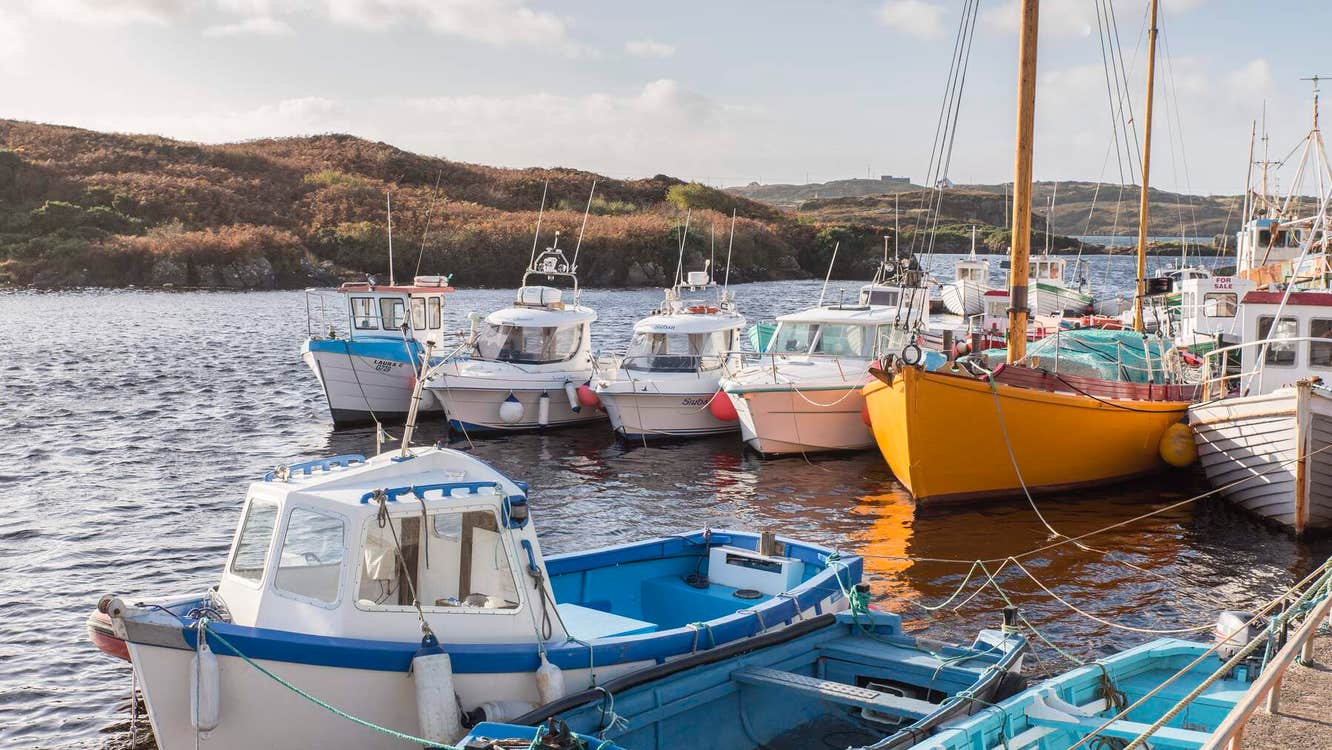 View of boats sitting in Bunbeg Harbour.