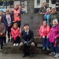 Rebel City Tour of Cork walking group gathered around the Thomas Mac Curtain monument
