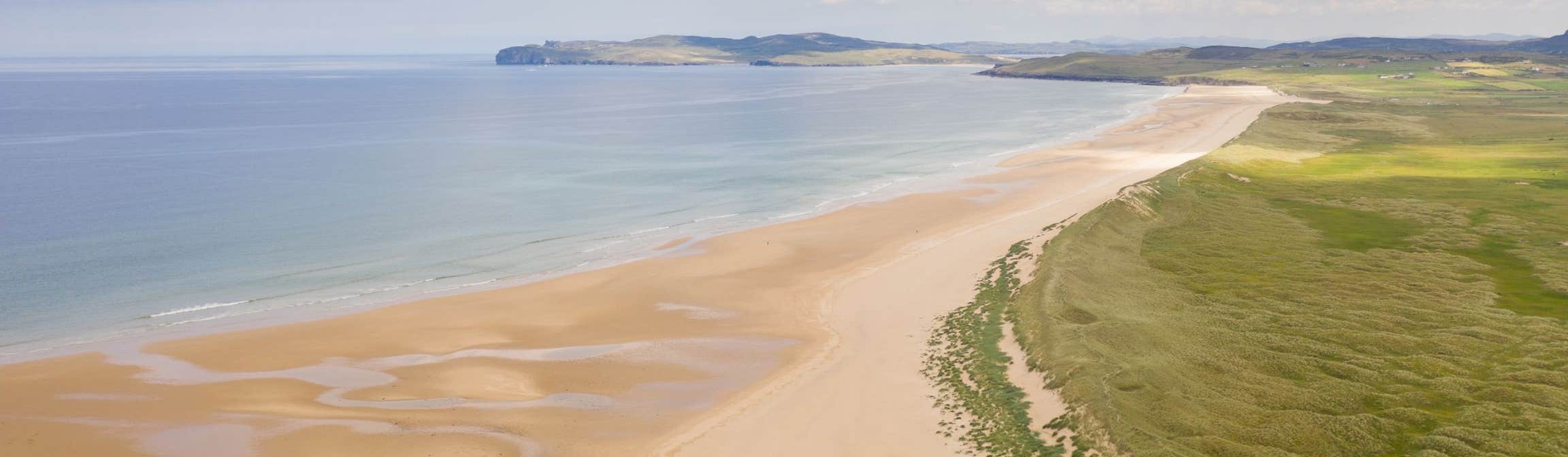 Golden sandy beach in Falcarragh in County Donegal on a sunny day