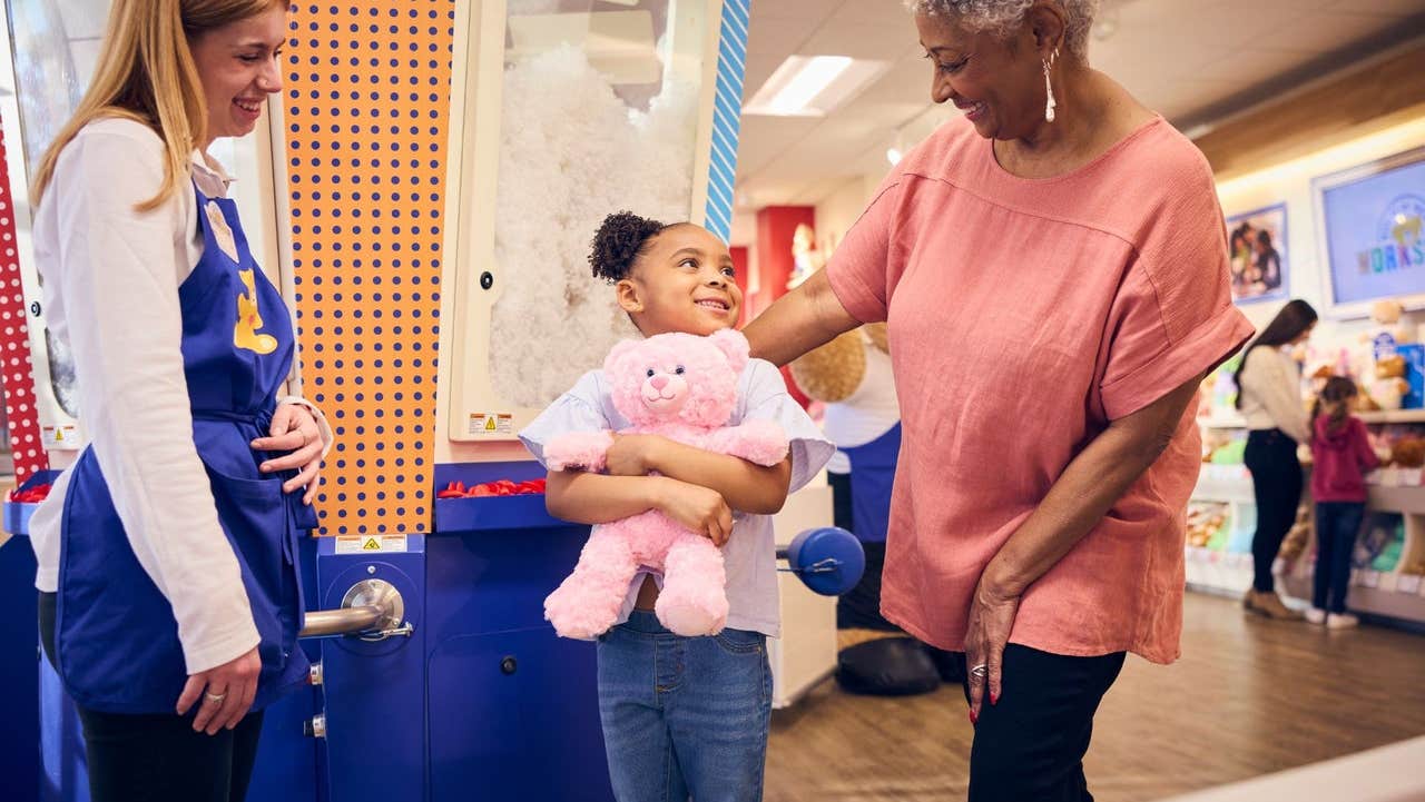 A happy child with their new teddy bear