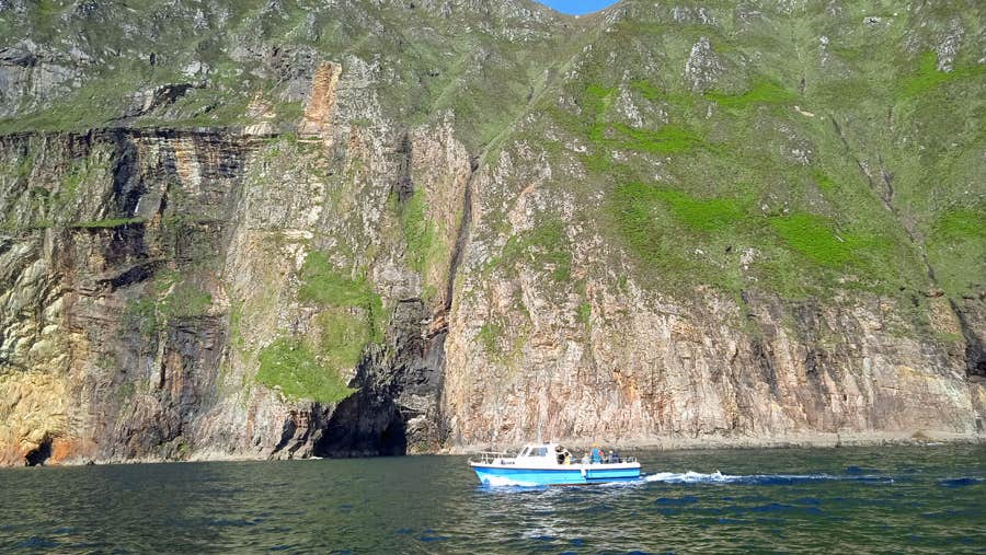Boat on the water with Sliabh Liag in the background
