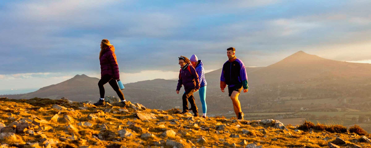 Four people hiking in Wicklow mountains on a Hilltop Treks tour