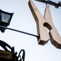 A large clothes peg sign outside The Washerwoman restaurant
