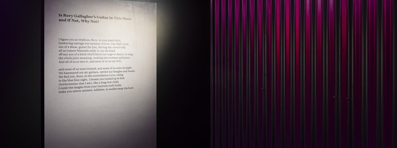 Image of Paula Meehan's poem 'Is Rory Gallagher's Guitar in This Show and If Not, Why Not?' from the Changing Ireland galleries at Collins Barracks
