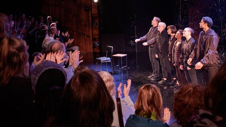 Th audience clapping for the performers in Citysong in the Abbey Theatre