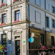 A view of the external of the Kilkenny Hibernian Hotel in Kilkenny City with a blue sky in the background