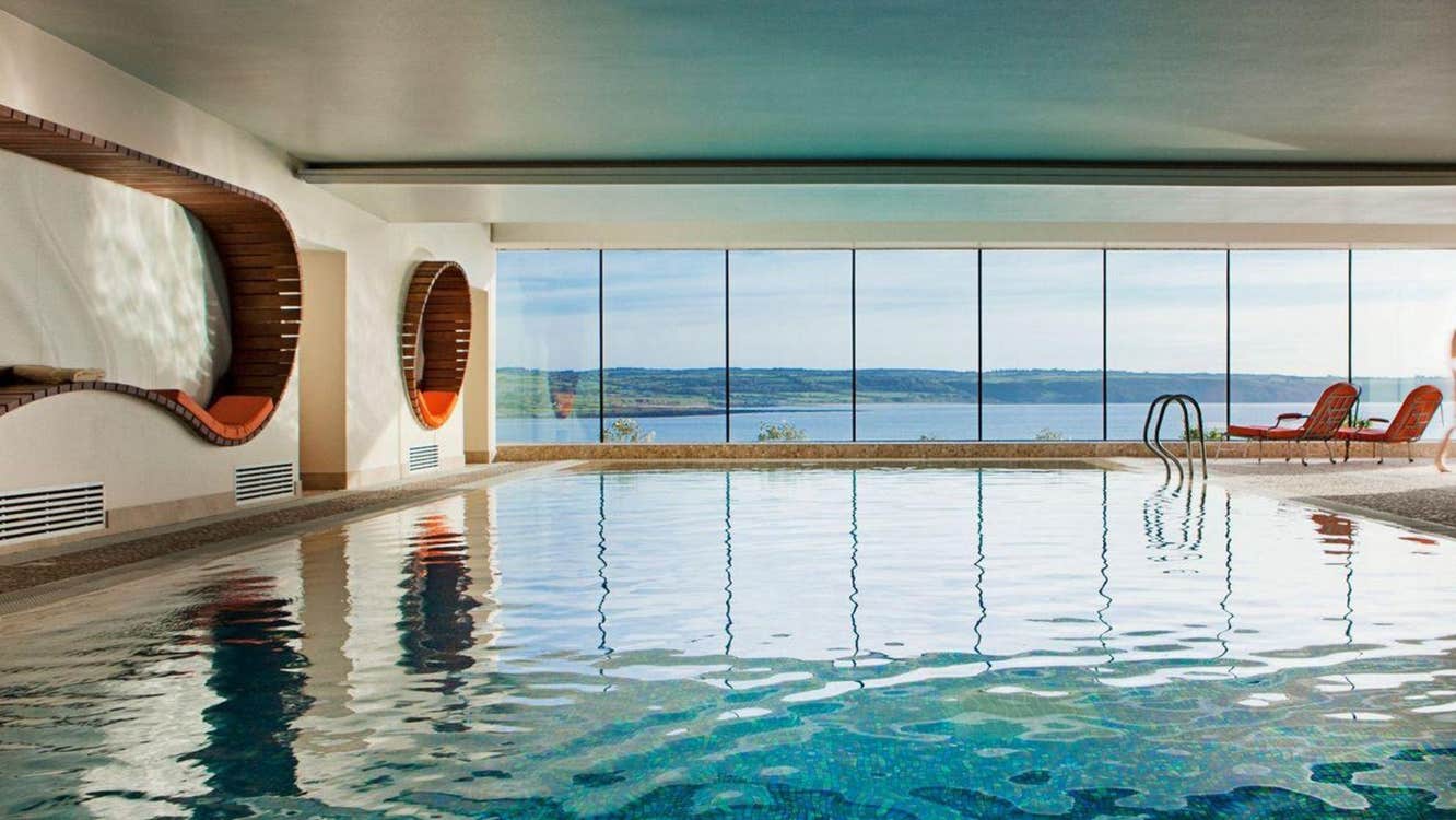 Indoor infinity edge swimming pool at The Well by the Sea Spa at the Cliff House Hotel