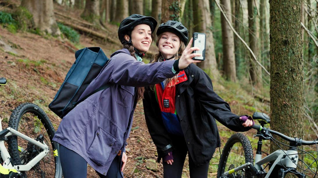 Two women taking a selfie with mountain bikes in Ballyhoura.