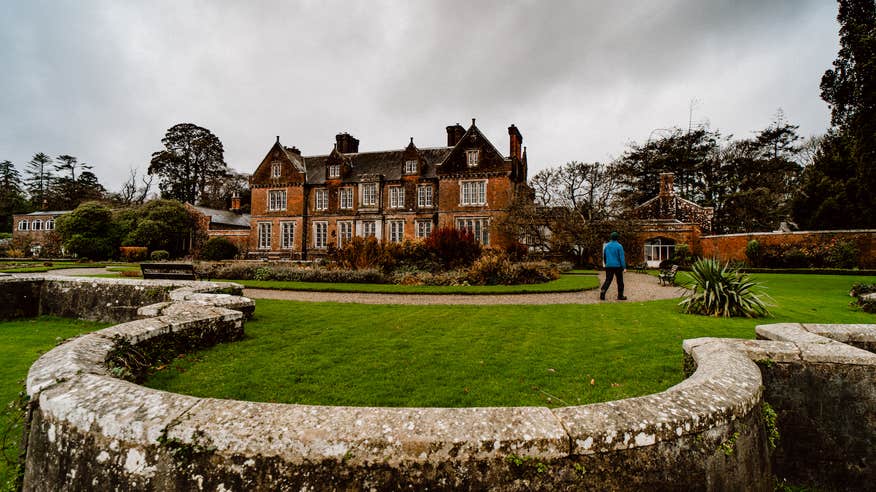 A man walking the grounds of Wells House and Gardens in County Wexford