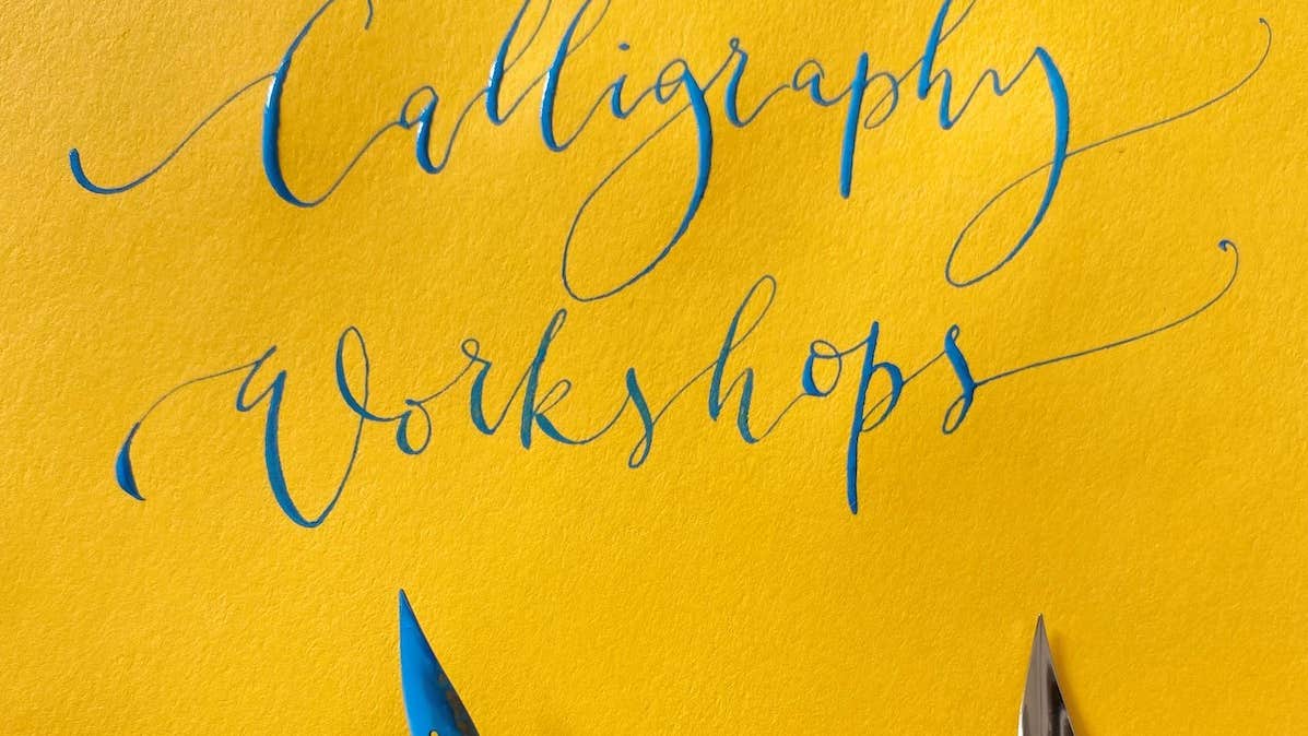 Modern Calligraphy with Sarah O'Dea - Bright yellow paper with curly, blue writing and some pen nibs.