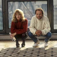 A man and a woman are crouched next to each other.