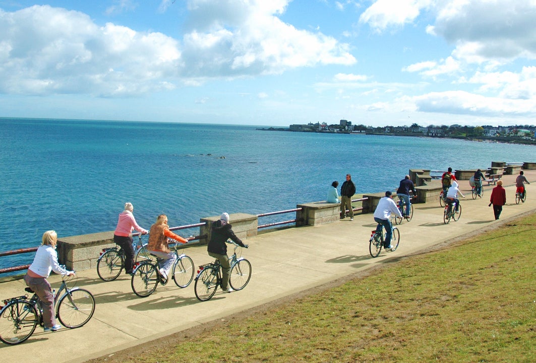 Irish Cycling Safaris cyclists on a path along the coast of Dublin Bay