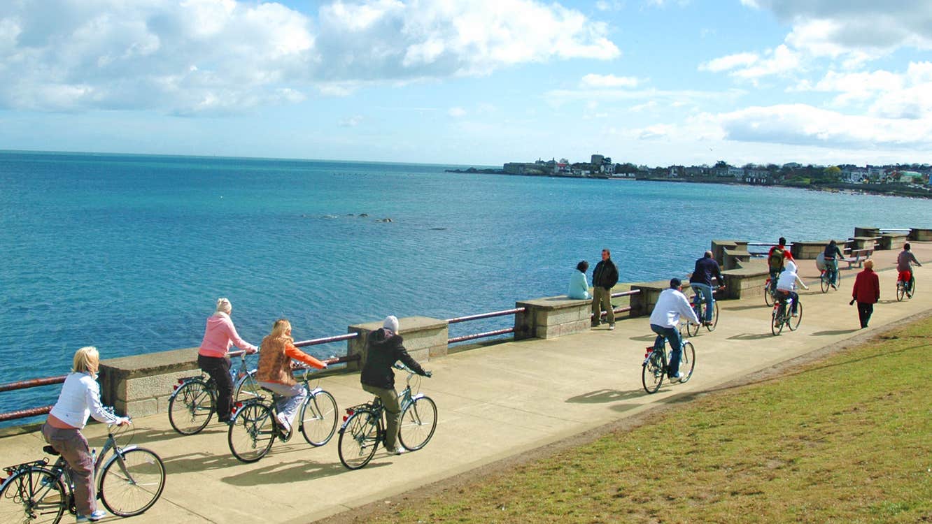 Irish Cycling Safaris cyclists on a path along the coast of Dublin Bay
